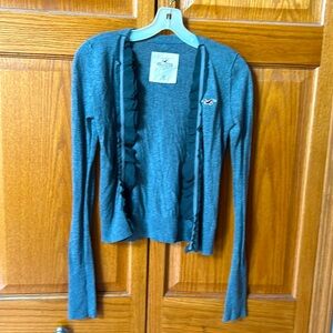 Hollister women’s XS cardigan. Heather gray. Ruffle trim. No closure.